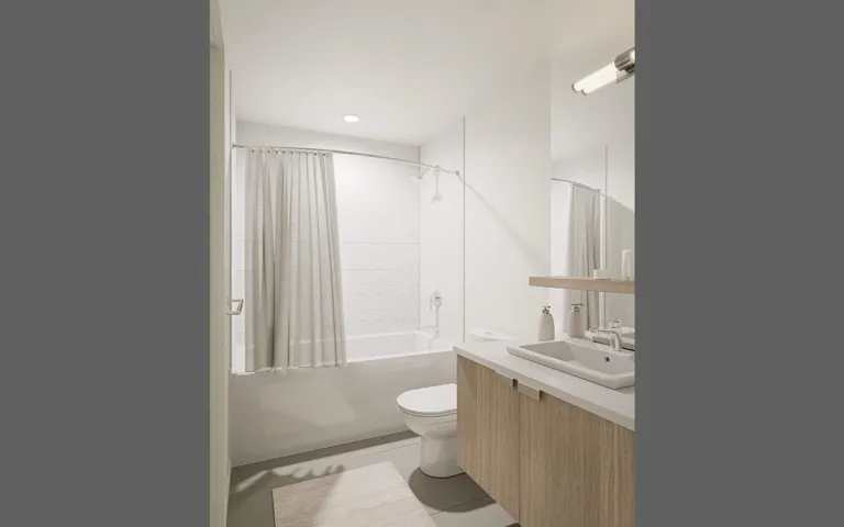 Full bathroom with vanity, shower / bath combo with shower curtain, tile patterned floors, and recessed lighting