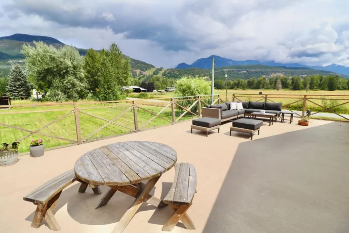 Expansive outdoor patio with natural wood fencing