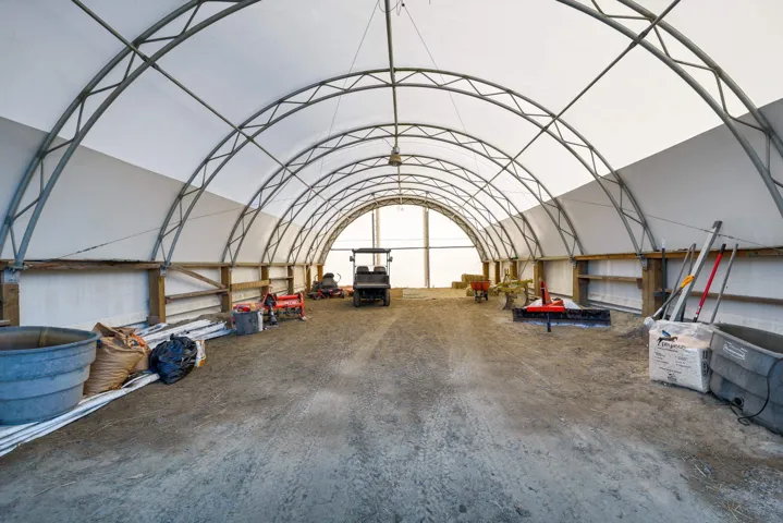 Misc room featuring a barrel ceiling and a garage