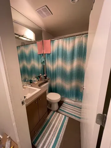 Full bath with vanity and tile patterned flooring