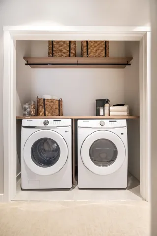 Laundry area with washing machine and clothes dryer