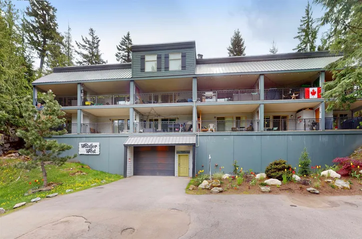 View of apartment building / complex with asphalt driveway