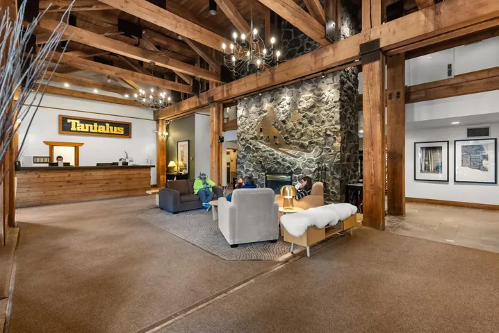 Lobby with beamed ceiling and high vaulted ceiling