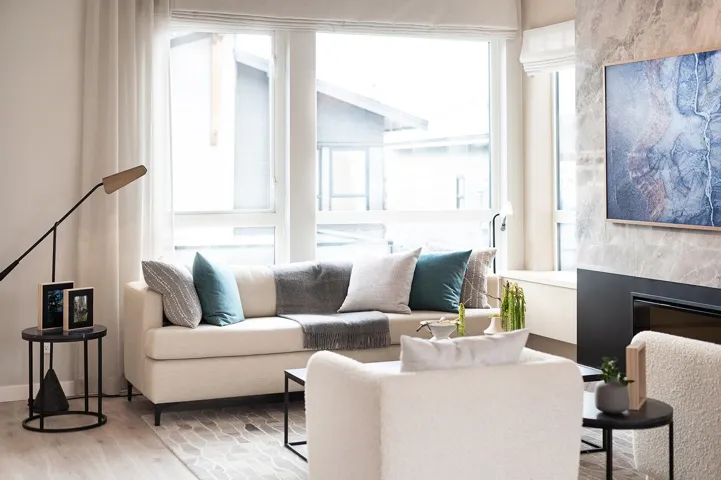Living room featuring wood finished floors and a high end fireplace