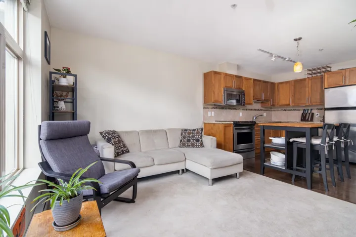Living room with wood finished floors and a wealth of natural light