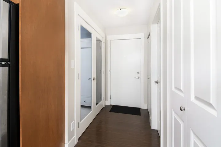 Hall with dark wood-type flooring