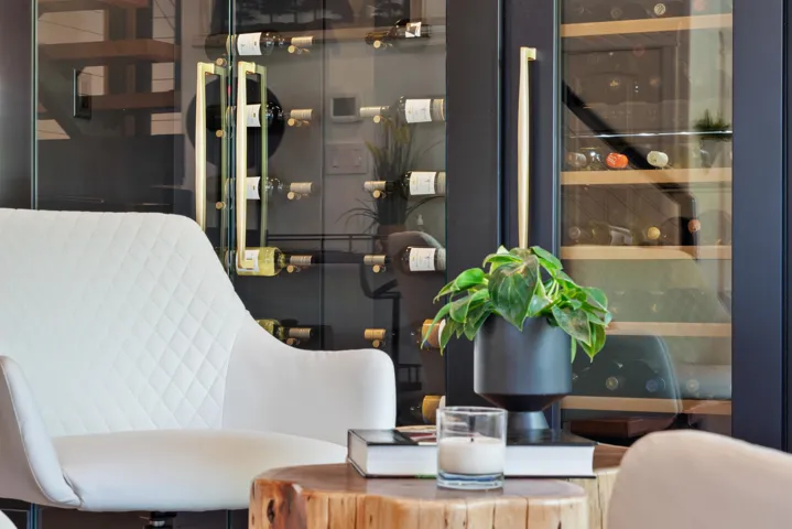 Live-edge wood dining table with a dark metal chandelier