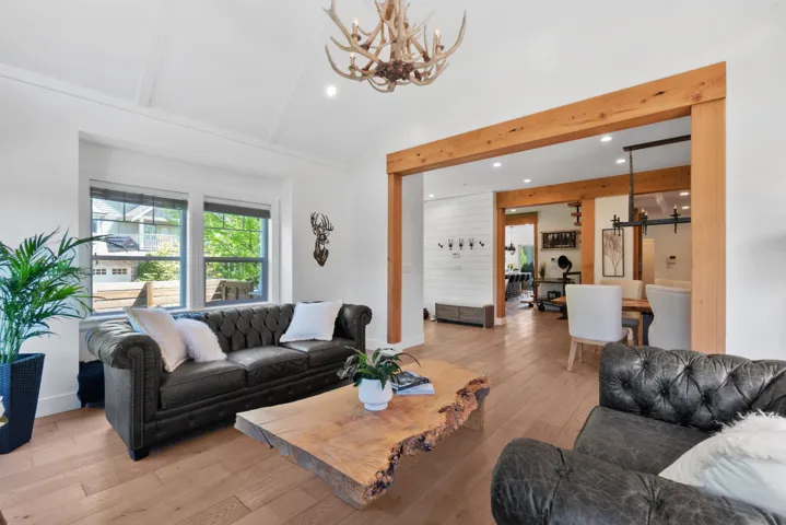 Recreation room featuring a pool table, stone-clad fireplace, and wood-finish flooring