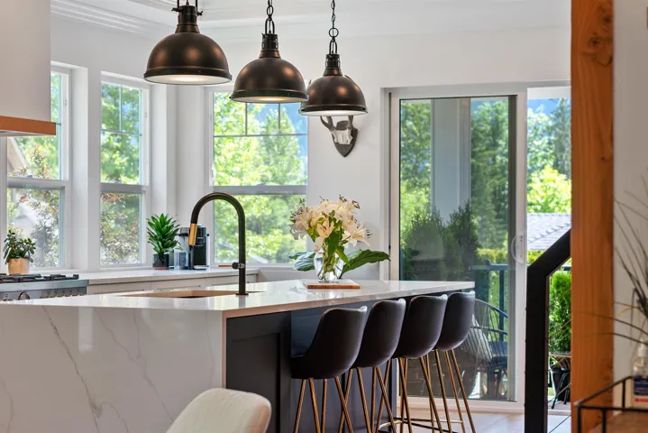 Built-in glass-front wine storage with gold-tone hardware