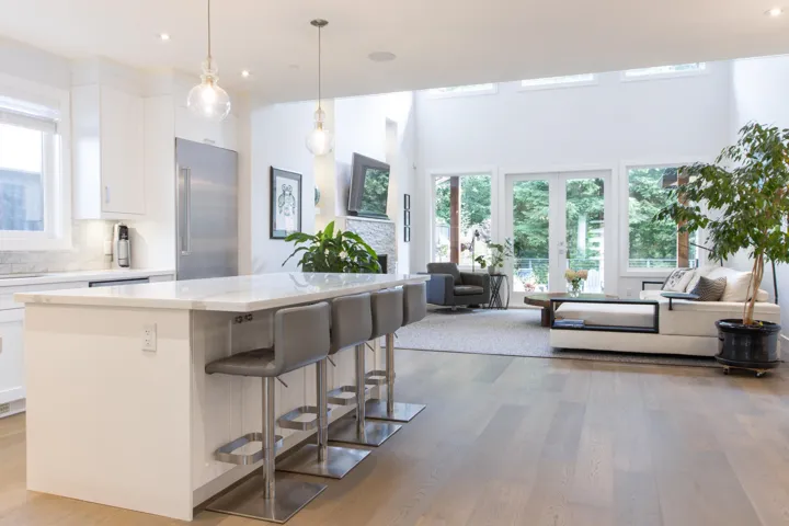 Living area with a towering ceiling and french doors