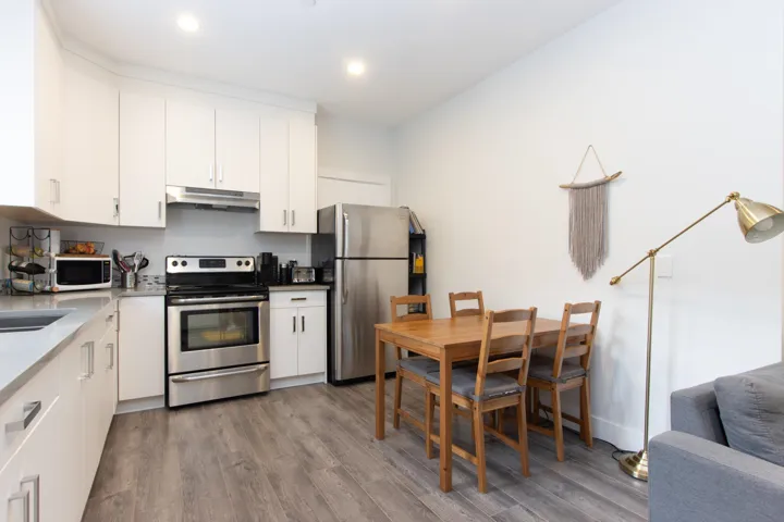 Bedroom with dark wood-style floors and recessed lighting