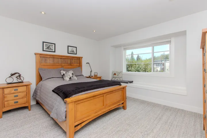 Full bathroom with ensuite bath, double vanity, and recessed lighting