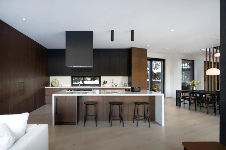 Kitchen with a kitchen breakfast bar, a spacious island, light wood-type flooring, modern cabinets, and recessed lighting