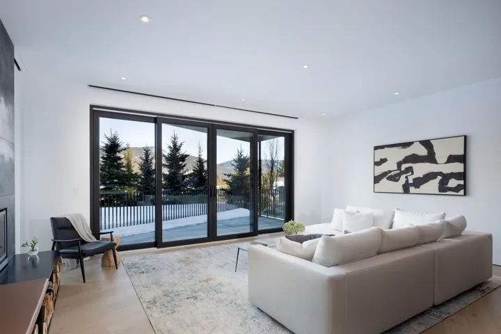 Living room featuring recessed lighting, light wood-style flooring, and a mountain view