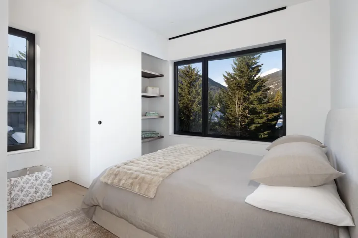 Bedroom featuring light wood-type flooring and a mountain view