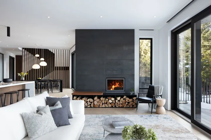 Living area with recessed lighting, a fireplace, and light wood finished floors