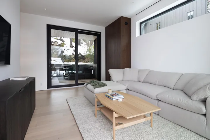 Living room with light wood-style flooring
