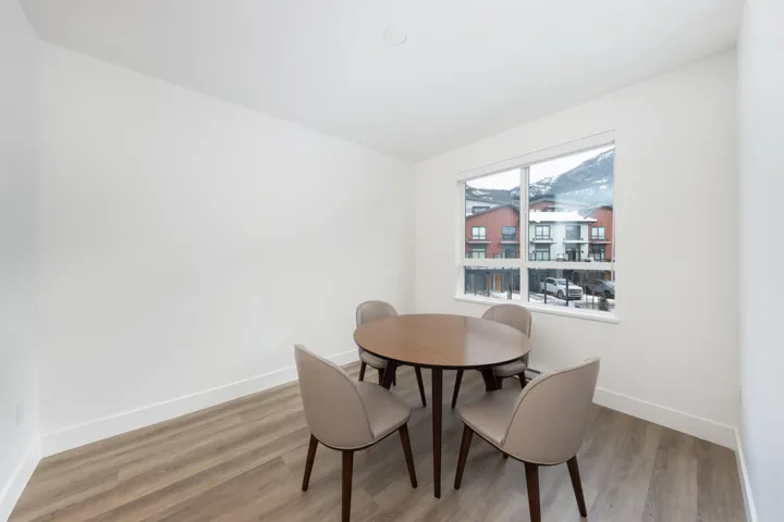 Dining space with baseboards and wood finished floors