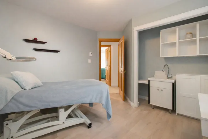 Bedroom featuring light wood-style floors and baseboards