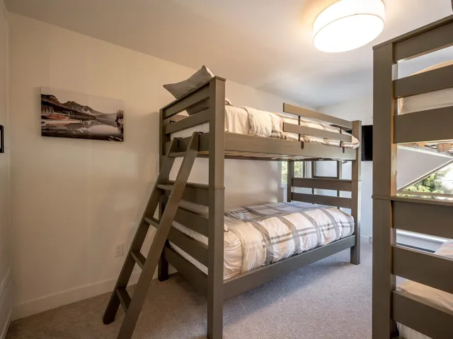 Carpeted bedroom featuring baseboards