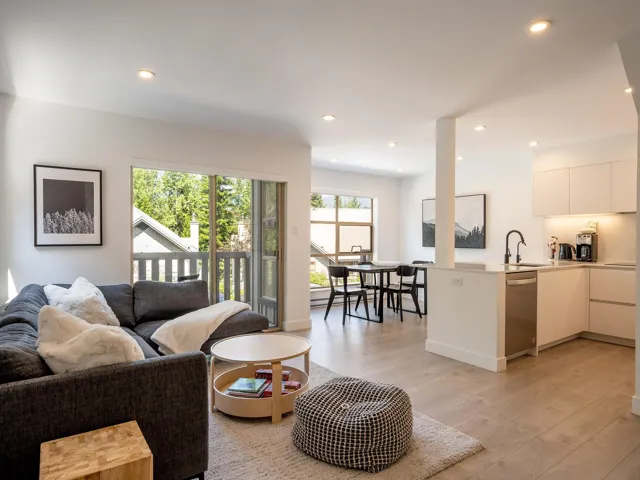 Living room with recessed lighting and light wood-style floors