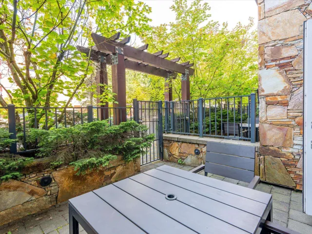 Exterior space featuring a pergola and outdoor dining area