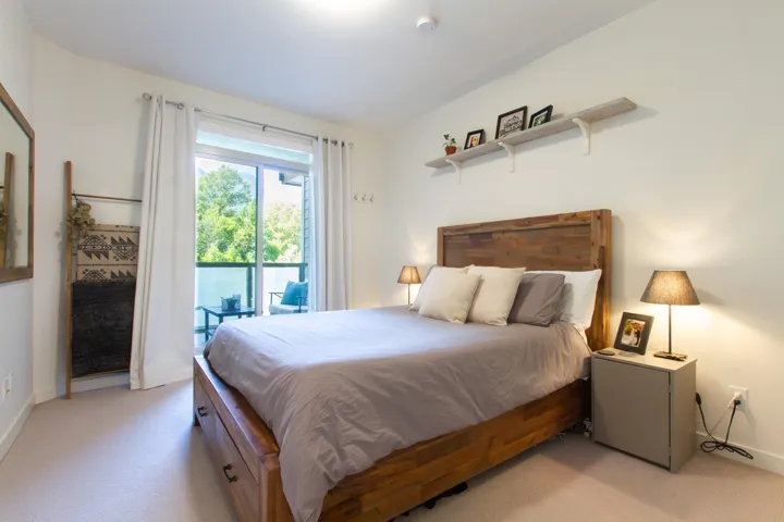 Bedroom with access to exterior and baseboards