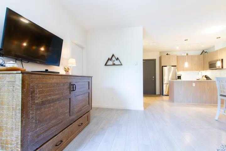 Living room featuring baseboards and light wood finished floors