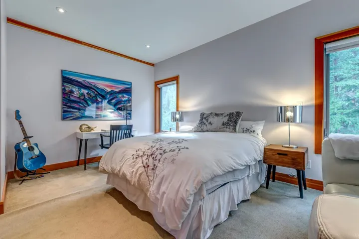 Bedroom featuring light carpet, baseboards, and recessed lighting