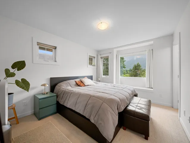 Room featuring light-toned carpeting and white painted walls