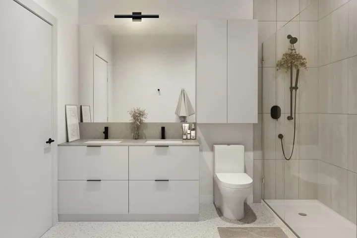Modern bathroom featuring a double vanity with matte black fixtures, integrated sinks, and ample storage cabinetry
