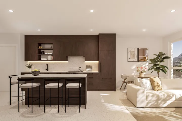 Modern kitchen featuring dark wood-finish cabinetry, a large center island with seating, a light-toned countertop, and recessed lighting
