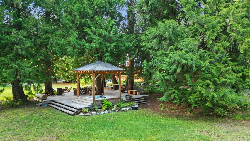 View of yard featuring a gazebo and a deck