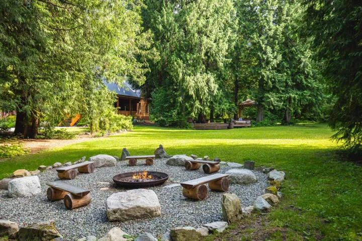 View of yard with an outdoor fire pit