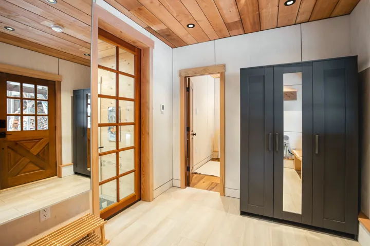 Doorway featuring recessed lighting and wooden ceiling