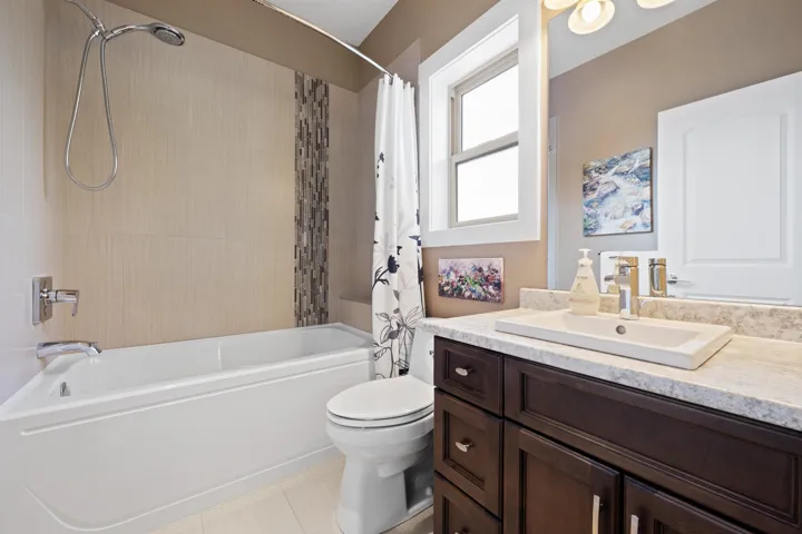 Full bath with vanity.