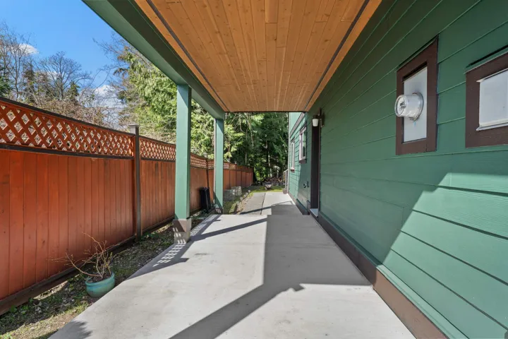 Covered walkway on the side of the home, to the back yard