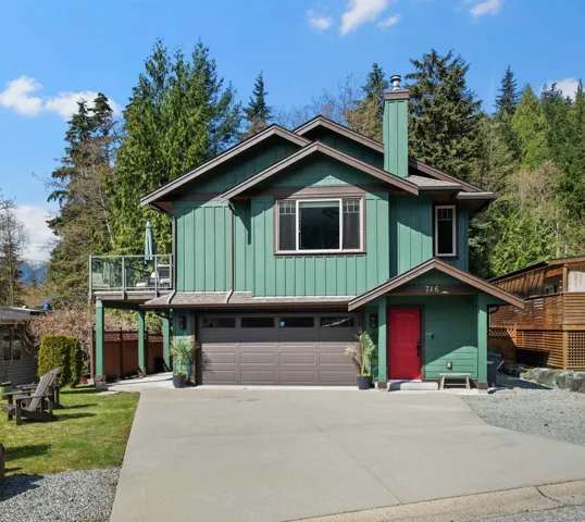 Street view of home with garage, driveway and front entry.