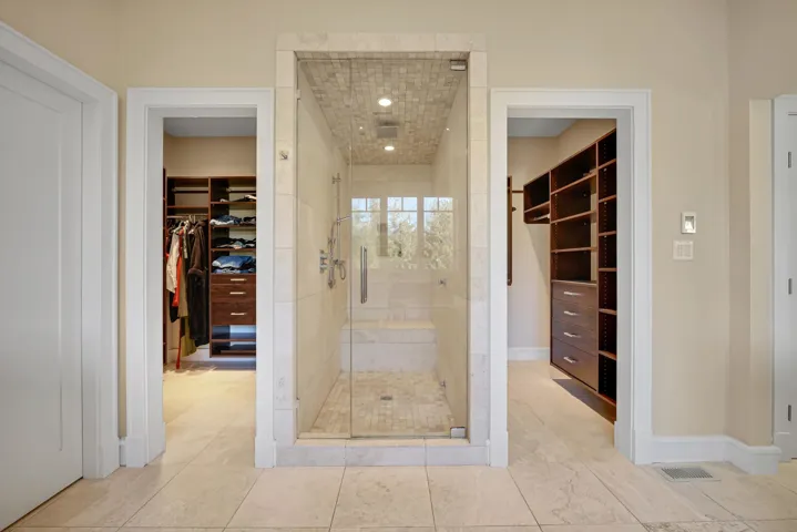 Steam shower and jacuzzi tub in primary ensuite.