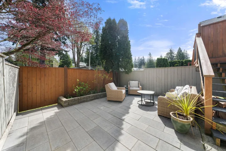 Frenced yard with paving stones