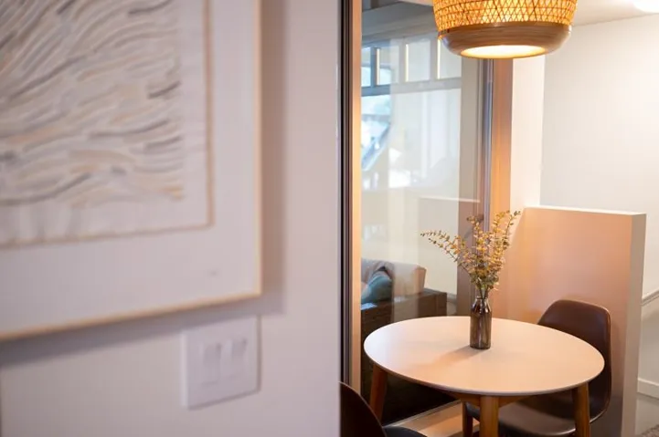 Glass paneling with a woven pendant light fixture