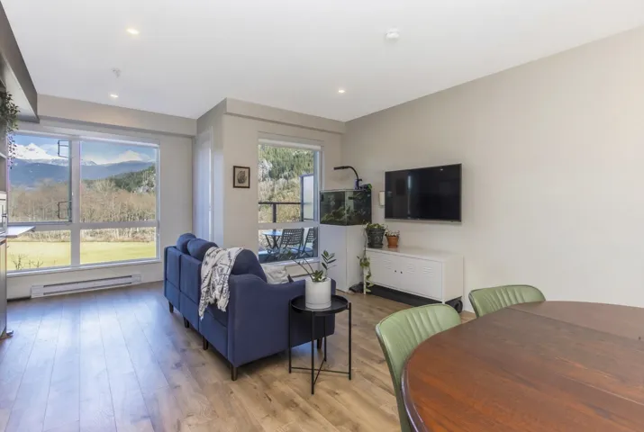 Open-concept living area with wood-finish flooring