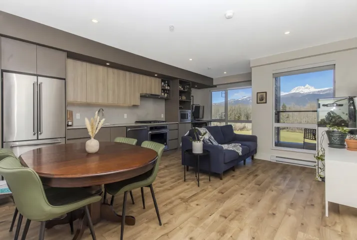 Open-concept living space with wood-finish flooring