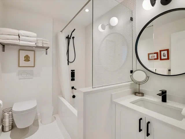 Bathroom featuring vanity, shower / bath combo, tile patterned flooring, recessed lighting, and toilet