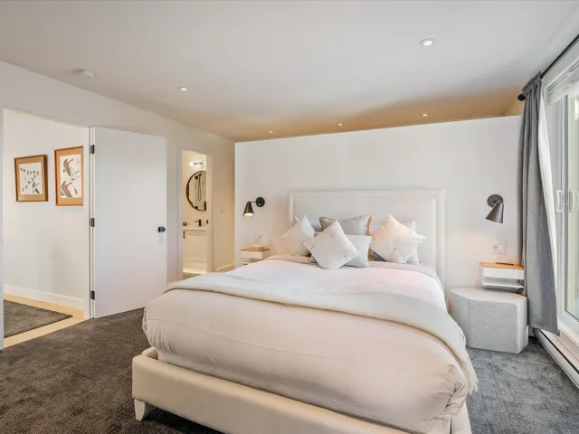 Bedroom featuring ensuite bathroom, baseboards, a baseboard radiator, recessed lighting, and carpet flooring