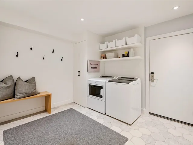 Laundry room with recessed lighting, separate washer and dryer, laundry area, and baseboards