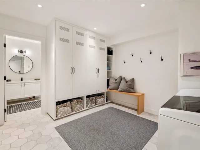 Mudroom with recessed lighting, light tile patterned floors, washer / dryer, and baseboards