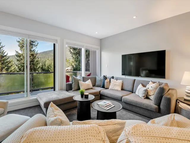 Carpeted living area featuring recessed lighting