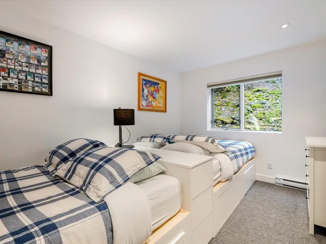 Bedroom featuring baseboards, recessed lighting, light colored carpet, and baseboard heating