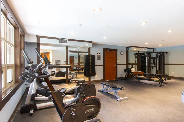 Exercise room featuring baseboards and recessed lighting
